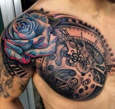 a man's chest with a clock and rose tattoo on his left side shoulder