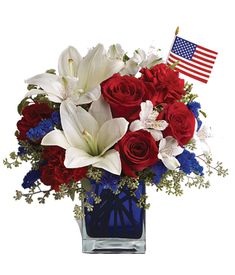 happy fourth of july bouquet with red, white and blue flowers in a square vase