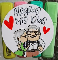 a sign that says, alegars mis dias with an older man and woman hugging each other