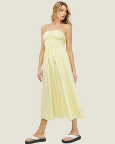 Feel radiant and beautiful in The Daisy: Lemon Poplin Ruched Strapless Maxi Dress. This strapless dress is designed to bring out your most feminine side. It's an effortlessly flattering midi dress with a shirred elastic bust - a comfortable and beautiful addition to your wardrobe Ruched Strapless Sundress For Brunch, Brunch Sundress With Ruched Detail, Sundress With Ruched Detail For Brunch, Spring Knee-length Maxi Dress With Ruched Bodice, Spring Sundress, Strapless And Knee-length, Spring Maxi Dress With Ruched Bodice, Knee-length, Knee-length Maxi Dress With Ruched Bodice For Spring, Summer Strapless Bandeau Dress With Pleated Bodice, Ruched Strapless Sundress For Summer