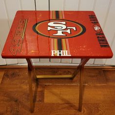 an old table with a san francisco logo on it and the word's off