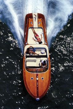 a person is swimming in the water on a boat that is being driven by a speedboat