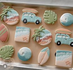 decorated cookies in the shape of cars, surfboards and palm trees