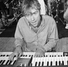 a man sitting in front of an electronic keyboard