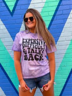 Go big or go home with our Expensive Difficult & Talks Back Purple T-Shirt! This super comfortable short sleeve tee is designed to offer the perfect blend of style, fun and comfort. Crafted with quality material for an eye-catching purple hue, this graphic tee is sure to become an instant summer favorite. Perfect for every day wear! Unisex sizing and fit Purple Graphic Tee, Go Big Or Go Home, Talking Back, Purple Design, Purple T Shirts, Summer Favorites, Purple Hues, Design T Shirt, Tshirt Colors