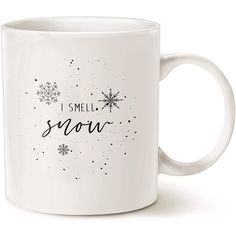 a white coffee mug with the words i smell snow printed on it