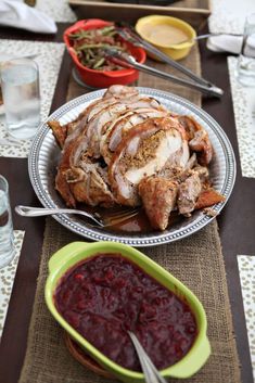 there is a turkey on the table with cranberry sauce