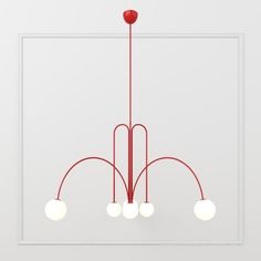 a red chandelier with five lights hanging from it's sides and three white balls on the bottom