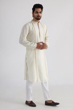 Buy Off White Kurta - Bam Silk Embroidery Thread Ruakh Placement Set For Men by Smriti by Anju Agarwal Online at Aza Fashions. Cream Long Sleeve Bandhgala For Eid, White Churidar With Resham Embroidery, Unstitched White Long Sleeve Churidar, Cream Bandhgala With Long Sleeves For Diwali, Cream Long Sleeve Nehru Jacket For Diwali, Cream Long Sleeve Bandhgala For Diwali, Off White Kurta With Gota Work For Eid, Festive Long Sleeve Churidar With Naqshi, Cream Long Sleeve Nehru Jacket With Naqshi