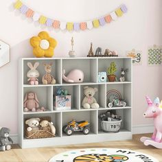 a child's room with stuffed animals and toys on the shelve shelves