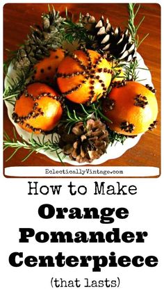 oranges and pine cones on a plate with text overlay how to make orange pomander centerpiece that last