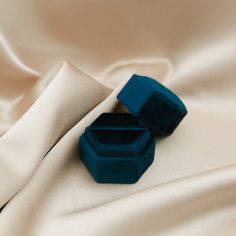 A small velvet ring box in your choice of color. Hexagon in shape, perfect for storing your favorite stud earrings or rings at home or on the go. Materials & Details Powder Blue, Denim Blue, Gray, Teal, Blush Pink, Cream, or Green Polyester Velvet Padded Base Width 2in x height 1 & 3/4in x depth 2in Velvet Ring Box, Dark Blue Grey, Blue Box, Light Denim, Powder Blue, Ring Box, Denim Blue, Deep Blue, Blue Gray