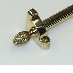 a close up of a handle on a door knob with an acorn shaped finial