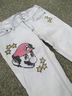 Mario Stars Bullhead Venice Skinny short hand bleach/drawn Jeans size 1 Ladies Up-cycled Hand bleached & hand drawn  Mario face with Stars. Jeans are whites and grays in color.  Measurements: Top to bottom: 37.5" Across waist: 14.5" Inseam: 30" Rise: 7" Material: 98% cotton,  2% Spandex Mario Star, Hand Drawn Design, Bleach, Jeans Size, Venice, Mario, Women Jeans, How To Draw Hands, Stars