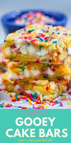 three gooey cake bars stacked on top of each other with sprinkles