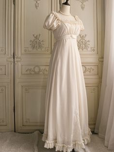 Immerse yourself in the elegance of the Regency era with this exquisite cream Bridgerton-inspired dress. Perfect for brides and special occasions, this gown combines vintage charm with luxurious details, making it a timeless addition to your wardrobe. Elegant Design: Featuring a classic Regency silhouette, this dress boasts puffed sleeves and a gracefully flowing skirt. The delicate chiffon ruffles and floral appliqués add a touch of romantic charm, while the beaded embellishments enhance its so Regency Era Nightgown, Regency Nightgown, Regency Silhouette, Regency Era Dress, Regency Dresses, Nontraditional Wedding Dress, Antoinette Dress, Wedding Dresses High Low, Floral Applique Dress