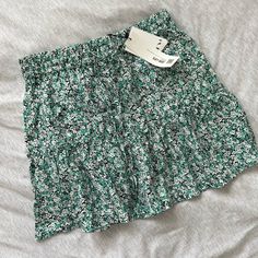 *Doesn’t Have Tags Anymore, Worn Only Once! Super Cute Floral Green And White Skirt From Zara, New With Tags! Selling Because I Don’t Love The Color On Me. Has Built In “Shorts” To Make It A Skort. I Love The Style It’s Cute And Flowy. Perfect For St. Patrick’s Day! Make An Offer :) Zara Green Vacation Skirt, Zara Floral Print Mini Skirt For Spring, Zara Casual Mini Skirt With Ruffles, Zara Casual Tiered Mini Skirt, Zara Floral Print Tiered Skirt, Zara Green Floral Print Bottoms, Vacation Green Mini Skirt With Floral Print, Floral Print Green Mini Skirt For Vacation, Trendy Green Mini Skirt With Floral Print