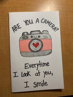 a card with the words are you a camera? i look at you, i smile