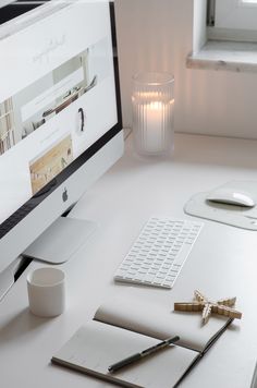 a desktop computer sitting on top of a white desk