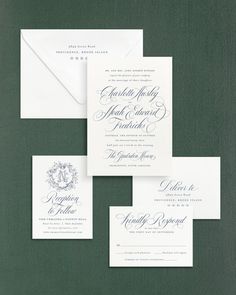 the wedding stationery is laid out on top of each other, including an envelope and two