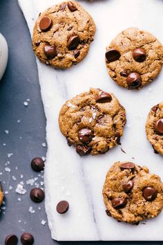 chocolate chip cookies and milk on a table