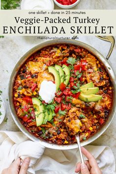 one skillet - packed turkey enchilada skillet with avocado and sour cream