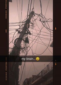 an electrical pole with wires all over it and the words, my brain on top