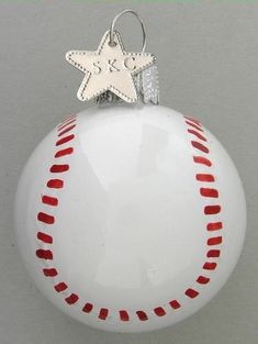 a baseball ornament with a star on top