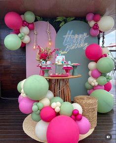 a birthday party with balloons and cake