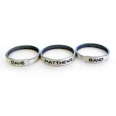 Simple little engraved rings handcrafted from sterling silver. Customize your rings to reflect what is important to you. Perhaps your children's names, an anniversary date or bible verse. We have given the band a rustic feel with darkened edges and a brushed finish. They will arrive ready to present as a gift. Band: 2mm wide, 1mm thick Made to order. Allow up to 14 business days for fabrication before shipment. There is a charge for the re-sizing of rings, please make sure of your proper ring si Adjustable Stackable Bands For Promise, Adjustable Engraved Promise Bands, Adjustable Stamped Stackable Rings For Everyday, Adjustable Stackable Promise Rings With Custom Name, Adjustable Personalized Stackable Rings, Adjustable Engraved Ring With Round Band, Adjustable Stackable Bands As Gift, Adjustable Customizable Engraved Sterling Silver Ring, Meaningful Engraved Adjustable Stackable Rings