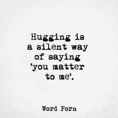 a black and white photo with the words hugging is a silent way of saying you matter to me