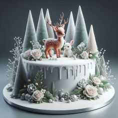 a cake decorated with white frosting and deer figurines on top of it