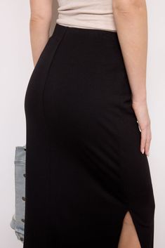 Elevate any look with this ribbed maxi skirt from LNA, crafted from stretch rib knit material, this skirt features a shorter double layer to prevent sheerness, an elastic waistband, and two side slits for easy movement. Pair with anything from your favorite graphic tee to a button-down. | LNA Women's Ribbed Maxi Skirt, Size XL, Black Solid Stretch Maxi Skirt, High Waist Stretch Solid Maxi Skirt, High Waist Stretch Maxi Skirt With Elastic Waistband, Stretch High Waist Maxi Skirt, High Waist Stretch Maxi Skirt, High Waist Stretch Elastane Maxi Skirt, Chic Ribbed Maxi Skirt For Spring, Spring High Waist Elastane Maxi Skirt, Fitted Ribbed Maxi Skirt