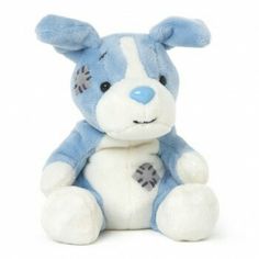 a blue and white stuffed animal sitting on the ground