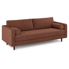 a brown couch sitting on top of a white floor