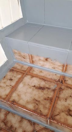 a tile floor that has been cleaned and stained