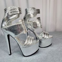 New, Never Worn Privileged Silver Open Toe Front Leatherette Upper With Quilted Design Hook & Loop Closure Lug Sole Tread 6.5" (Approx) Stiletto Heel Chunky Platform Lightly Padded Insole Strap Closure For Easy On & Off May Have Glue Remainder Marks Silver Platform Heels In Synthetic Material, Silver Synthetic Platform Heels, Silver Fitted Platform Heels, Fitted Silver Platform Heels, Glamorous Metallic Platform Heels, Metallic Platform Heels With Synthetic Material, Metallic Platform Heels In Synthetic Material, Metallic Closed Toe Heels For Night Out, Metallic High Heel Synthetic Sandals