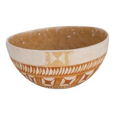 a brown and white bowl sitting on top of a table