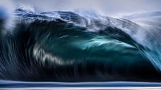 an ocean wave is shown in this artistic photo