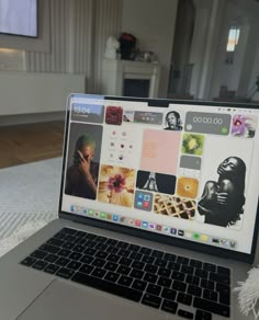 an open laptop computer sitting on top of a bed