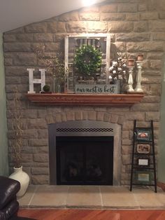 a living room with a fire place and a window on the wall over the fireplace