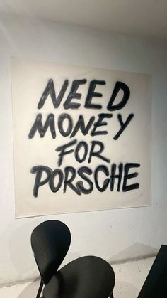 two chairs and a sign that says need money for porschie on the wall