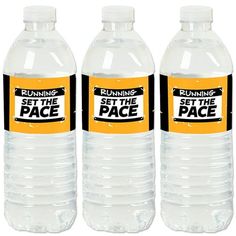 three bottles of running set the pace water on a white background with black and yellow labels