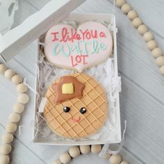 a decorated cookie in a box on a table