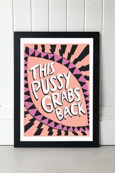 this pussyy grab's back poster in pink and black is hanging on the wall