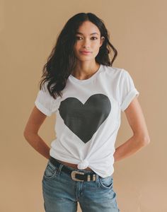 Big heart printed with soft-to-the-touch water based inks. Shirt will age like your favorite vintage shirts.  Thank you for supporting my independent small business!  Printed on a premium quality knit cotton jersey crewneck, super soft tee. Can be cuffed at the sleeves, knotted and chucked on for an easy comfortable outfit.  4.2 oz., 100% combed and ring-spun cotton Unisex sizing Shoulder taping Side-seamed Relaxed Fit Heart Print T-shirt For Summer, Trendy Heart Graphic T-shirt For Summer, Casual Heart Print T-shirt For Summer, Summer Cotton T-shirt With Heart Print, Casual Heart Print T-shirt With Relaxed Fit, Black Heart Print T-shirt For Spring, White Heart Print T-shirt For Summer, Everyday Graphic Tee With Heart Graphic, Heart Graphic Tee For Everyday