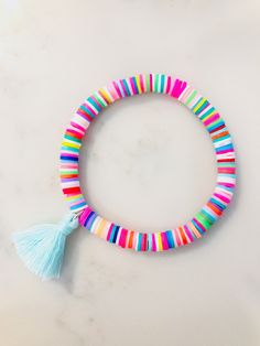 "6mm Solid Rainbow Heishi Bead Bracelet with Soft Aqua Cotton Tassel Womens or Girls Stretch Stackable Bracelet ✨ 🤍 6mm polymer clay rainbow Heishi beads are soft and comfortable to wear. 🤍 Super cute mini (20mm) soft aqua cotton tassel makes this bracelet extra special! 🤍 Fun and colorful just in time for Spring 🌸 🤍 Wear as a single bracelet or Stack your Style! 🤍 All bracelets are double strung with thick elastic string for durability. 🌟🌟 Please select size at checkout. If you are unsu Heishi Bracelet Ideas, Heishi Jewelry, Heishi Bracelets, Heishi Bracelet, Preppy Bracelets, Preppy Jewelry, Bracelets With Meaning, Etsy Diy, Pearls Diy