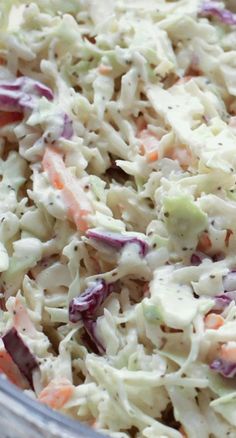 a bowl filled with coleslaw and carrots