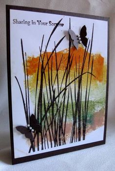 a handmade card with an image of grass and butterflies on it, which reads sharing in your own