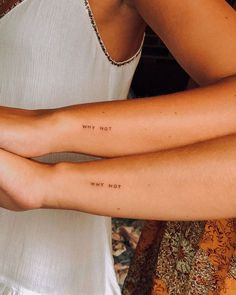 two women with their arms wrapped around each other and the words, why not? written on them